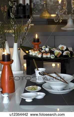 Sushi on table with candles View Large Photo Image Stock Image - Sushi on table with candles. Fotosearch
