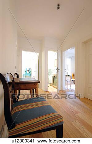 Table and chairs on corridor View Large Photo Image Stock Image - Table and chairs on corridor. Fotosearch