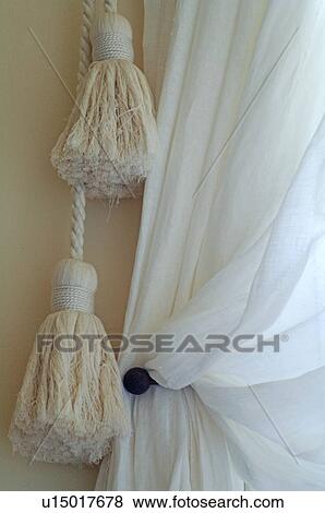 Stock Photo - Tassels at window curtain. Fotosearch
