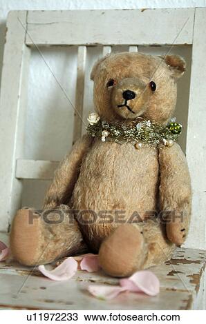 Teddy bear on wooden chair View Large Photo Image Stock Image - Teddy bear on wooden chair. Fotosearch