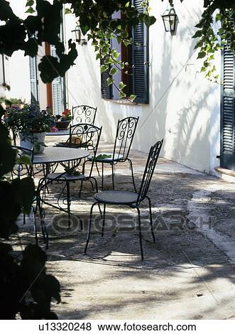 Terrace with garden table and chairs View Large Photo Image Stock Photo - Terrace with garden table and chairs. Fotosearch