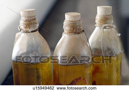 Three bottles of oil View Large Photo Image Stock Image - Three bottles of oil. Fotosearch