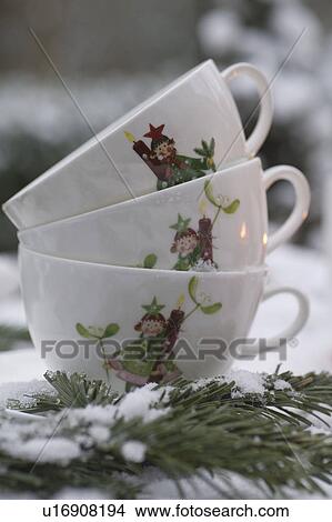 Three cups with Christmas imprint and fir branch View Large Photo Image Picture - Three cups with Christmas imprint and fir branch. Fotosearch