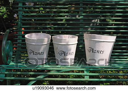 Three flower pots on bench View Large Photo Image Stock Photograph - Three flower pots on bench. Fotosearch