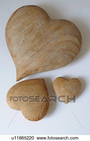 Three heart-shaped wooden worry stone View Large Photo Image Stock Image - Three heart-shaped wooden worry stone. Fotosearch