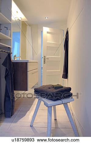 Towels on stool in bathroom View Large Photo Image Stock Image - Towels on stool in bathroom. Fotosearch