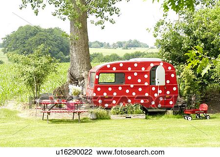 Stock Image - Trailer in garden. Fotosearch