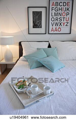 Tray with coffee cups and bread on bed View Large Photo Image Stock Image - Tray with coffee cups and bread on bed. Fotosearch