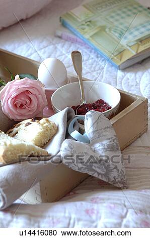 Tray with jam, egg, currant bun and rose on bed View Large Photo Image Stock Image - Tray with jam, egg, currant bun and rose on bed. Fotosearch