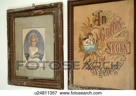 Stock Photo - Two antique pictures in frames at wall. Fotosearch