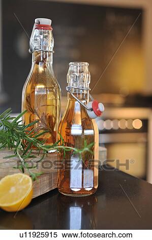 Two bottles of rosemary oil View Large Photo Image Stock Photography - Two bottles of rosemary oil. Fotosearch