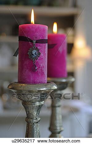 Stock Photo - Two burning candles. Fotosearch