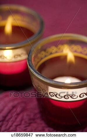 Two burning tea lights View Large Photo Image Stock Photo - Two burning tea lights. Fotosearch