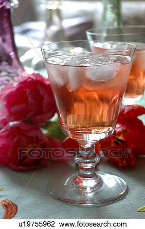 Stock Image - Two cold drinks and flower blossoms. Fotosearch
