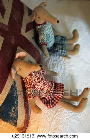 Stock Image - Two cuddly dogs sitting. Fotosearch