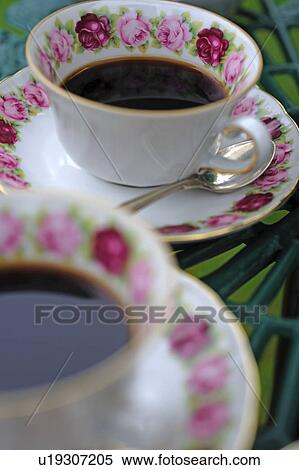 Two cups of coffee on garden table View Large Photo Image Stock Photography - Two cups of coffee on garden table. Fotosearch
