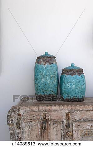 Stock Image - Two earthenware jugs on dresser. Fotosearch