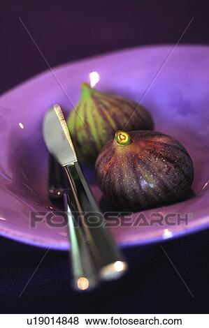 Stock Photo - Two figs on a plate. Fotosearch