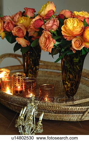 Two flower vases and candles on golden tray View Large Photo Image Stock Image - Two flower vases and candles on golden tray. Fotosearch
