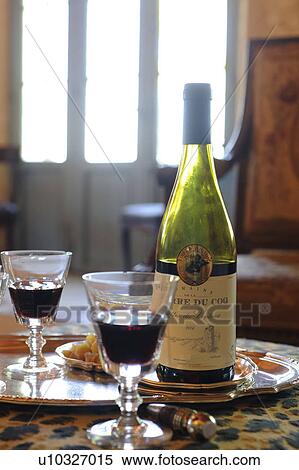 Stock Photography - Two glasses and bottle of red wine on tray. Fotosearch