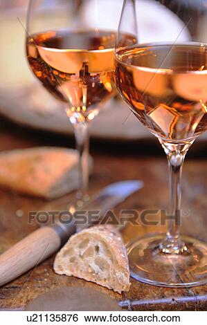 Two glasses of rosé wine and baguette View Large Photo Image Stock Photograph - Two glasses of rosé wine and baguette. Fotosearch