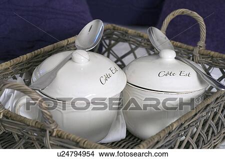 Picture - Two porcelain receptacles with spoons. Fotosearch