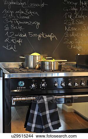 Two pots on cooker View Large Photo Image Picture - Two pots on cooker. Fotosearch