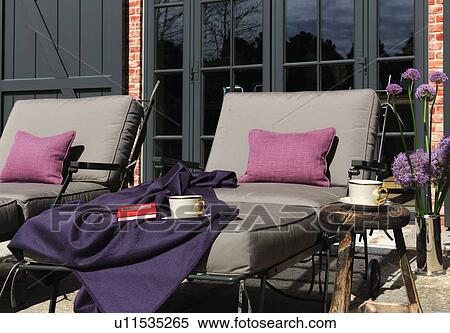 Stock Photography - Two sun loungers at country house. Fotosearch