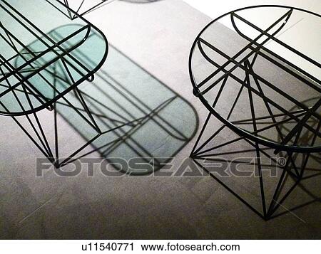 Stock Image - Two tables on carpet. Fotosearch