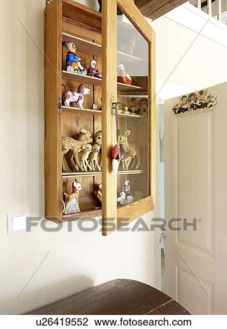 Stock Image - Vitrine with animal figurines. Fotosearch