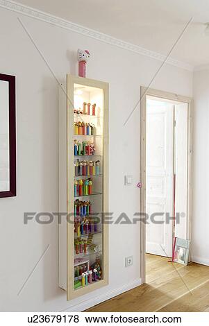 Stock Photo - Vitrine with collection of figurines. Fotosearch