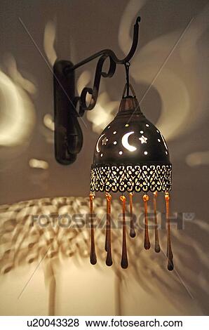 Wall lamp with moon and stars pattern View Large Photo Image Stock Photo - Wall lamp with moon and stars pattern. Fotosearch