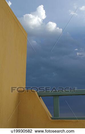 Wall of a house and cloudy sky View Large Photo Image Stock Image - Wall of a house and cloudy sky. Fotosearch