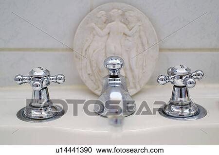 Water tap and medallion View Large Photo Image Stock Image - Water tap and medallion. Fotosearch