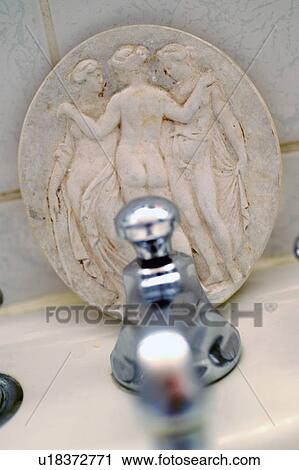 Water tap and medallion View Large Photo Image Stock Image - Water tap and medallion. Fotosearch