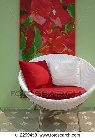 Stock Photo - White armchair and picture of a flower. Fotosearch