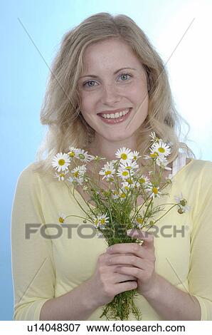 Woman holding bunch of flowers View Large Photo Image Stock Photo - Woman holding bunch of flowers. Fotosearch