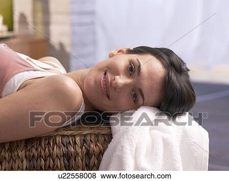 Stock Photo - Woman lying on massage couch. Fotosearch