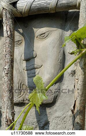 Stock Photo - Womans face in stone. Fotosearch