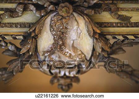 Stock Photograph - Womans figurine at an antique table. Fotosearch