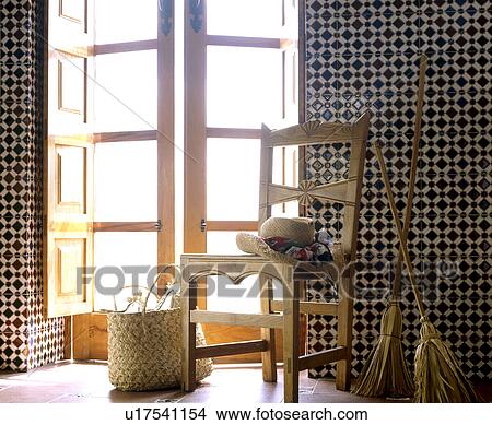 Wooden chair, bag and broom in front of window View Large Photo Image Picture - Wooden chair, bag and broom in front of window. Fotosearch