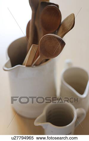 Stock Photography - Wooden spoons in a jug. Fotosearch