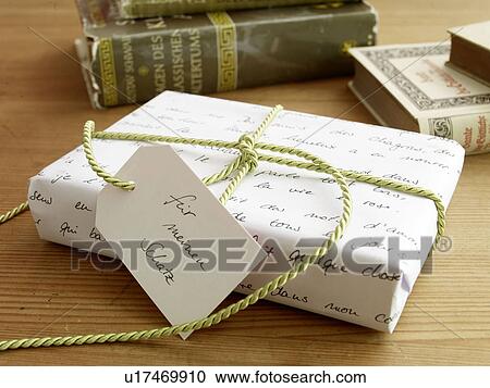 Wrapped gift with gift tag View Large Photo Image Stock Image - Wrapped gift with gift tag. Fotosearch
