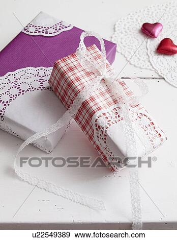Wrapped gifts with hearts View Large Photo Image Stock Photo - Wrapped gifts with hearts. Fotosearch