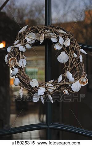Wreath hanging at window View Large Photo Image Stock Photography - Wreath hanging at window. Fotosearch