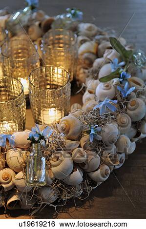 Wreath made of snail shells and candles View Large Photo Image Stock Photograph - Wreath made of snail shells and candles. Fotosearch