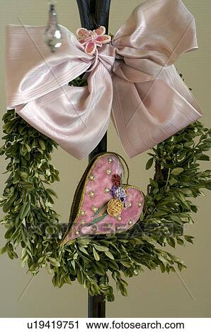 Stock Image - Wreath with bow and heart. Fotosearch