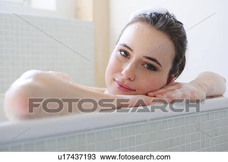 Young woman enjoying bath View Large Photo Image Stock Image - Young woman enjoying bath. Fotosearch
