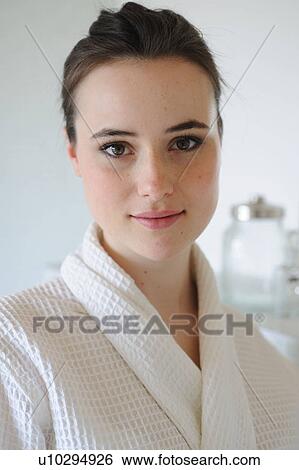 Young woman in bathrobe View Large Photo Image Stock Photograph - Young woman in bathrobe. Fotosearch