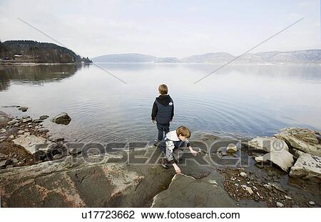 2 boys at lake View Large Photo Image Stock Image - 2 boys at lake. Fotosearch
